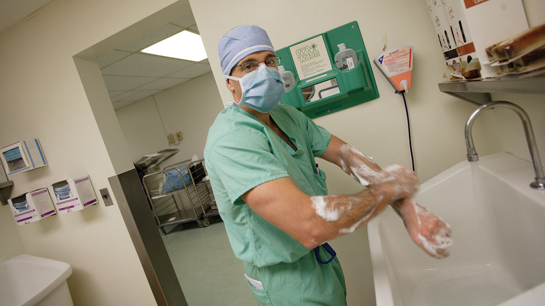 Stuart Geffner, M.D., of Saint Barnabas Medical Center, scrubbing in for surgery