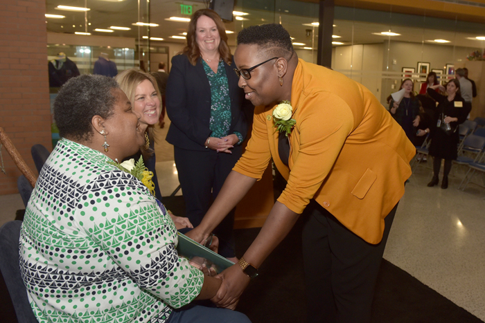 Donnetta Quarles-Reese, seated on stage with First Lady of Virginia Suzanne S. Youngkin, is welcomed by Dr. Brittany Clayborne, heart recipient and advocate. UNOS CEO Maureen McBride, Ph.D., looks on.