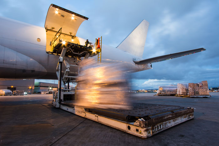 Cargo being loaded on to airplane