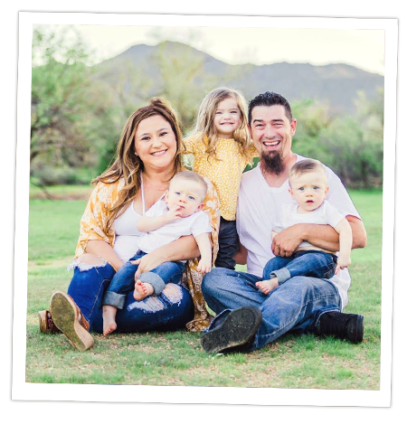 Siqueiros family sitting in grass