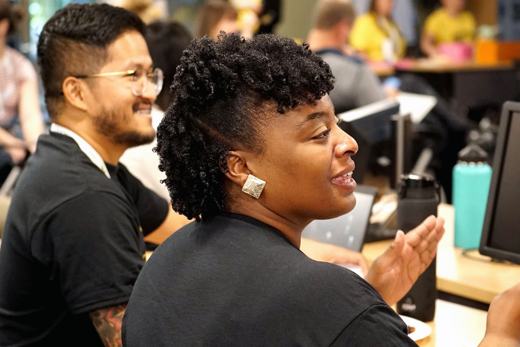 Side-view of UNOS employee talking during a SONU day. SONU events are employees collaborating across departments to develop innovative ideas to benefit organ donation and transplant.